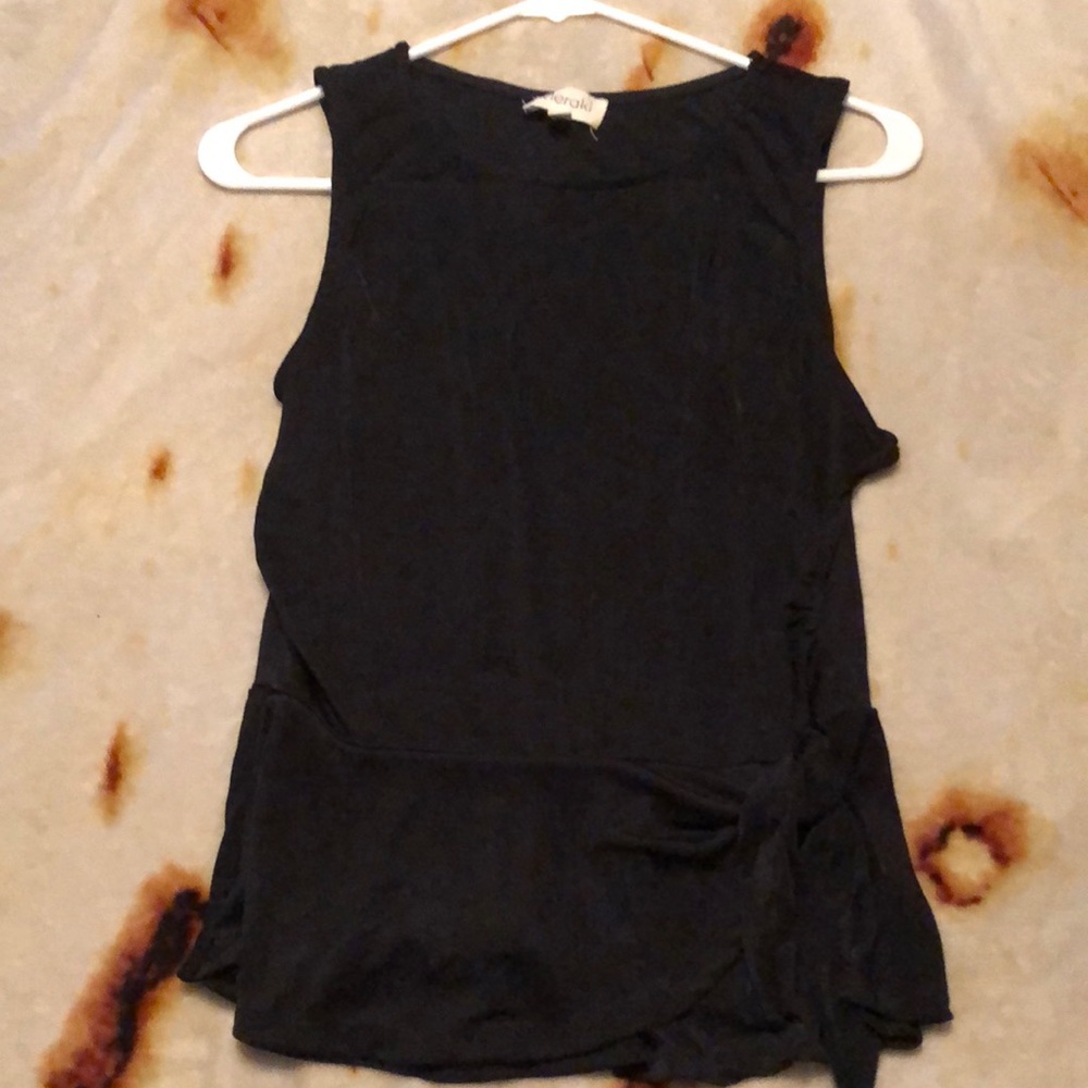 Méralo sleeveless blouse. Sheer lightweight with a side tie near the hip Size L